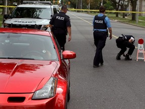 Windsor police investigate where a man driving a Nissan 350Z escaped serious injury after gunshots were fired in his direction, one hitting the front wind shield Sept. 9, 2015. A bullet hole near the driver?s side wind shield was visible and police recovered two bullets in the middle of Howard Ave. (NICK BRANCACCIO/The Windsor Star)