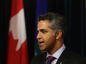 Minister of Human Services Irfan Sabir comments on Bill 3, the Appropriation (Interim Supply Act) that reverses cuts to health care and invests in  public services during a news conference at the Alberta Legislature on Thursday, June 18, 2015. (Perry Mah/Edmonton Sun)
