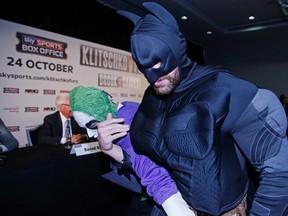 Boxer Tyson Fury, dressed as Batman, tussles with someone dressed as the Joker during a press conference featuring Wladimir Klitschko in London on Wednesday, Sept. 23, 2015. (Action Images via Reuters/Andrew Couldridge)