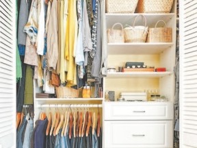 Clothes hung neatly in organized closet at home
