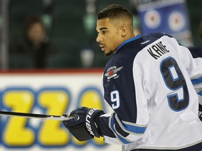 Winnipeg Jets forward Evander Kane juggles the puck before a game against the Calgary Flames at the Saddledome Monday February 2, 2015. (Postmedia Network file photo)