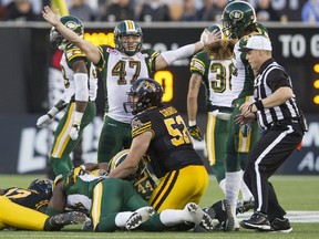 Edmonton Eskimos JC Sherritt celebrates his team's fumble recovery against the Hamilton Tiger-Cats during the second half of their CFL football game in Hamilton, Ontario, Canada, September 19, 2015.    REUTERS/Mark Blinch