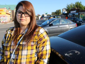 Casandra Asselstine, 23, had her car swarmed in the University District on Sept. 8. Her car’s spoiler was torn off, its front bumper was broken and the passenger side was scratched. (Steph Crosier/The Whig-Standard)