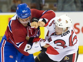 Ottawa Senators forward Vincent Dunn and Montreal Canadiens forward Jeremy Gregoire fight during an NHL Rookie Tournament hockey game at Budweiser Gardens in London, Ont., on Sept. 13. (Craig Glover/Postmedia Network)