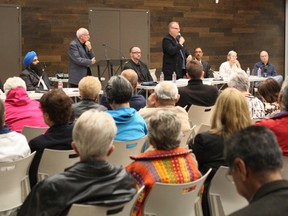 From the left, NDP candidate Jasvir Deol, Conservative Party of Canada candidate Tim Uppal, the furm moderator, Christian Heritage Party candidate Peter Downing, Green Party Candidate Ralph McLean, Liberal Party of Canada candidate Amarjeet Sohi, Communist Party candidate Naomi Rankin, and independent Colin Stubbs field questions at a Mill Woods public forum at the the Mill Woods Seniors and Multicultural Centre on Sept. 23, 2015.