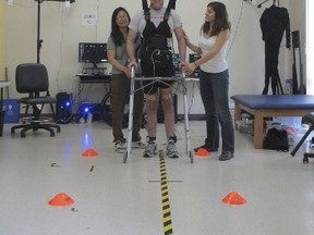 Former graduate student Adam Fritz, 28, who severed his spinal cord in a motorcycle accident, is shown during a brain-computer interface experiment at UC Irvine's iMove Lab in Irvine, California, in this image released on September 23, 2015. A brain-to-computer technology that can translate a patient's thoughts into leg movements enabled Fritz, who is paralyzed from the waist down, to become the first such patient to walk without the use of robotics, UC Irvine doctors reported on Wednesday. Picture pixelated at source. REUTERS/University of California Irvine/Handout via Reuters