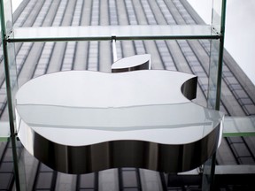 An Apple logo hangs above the entrance to the Apple store on 5th Avenue in the Manhattan borough of New York City, in this July 21, 2015, file photo.  REUTERS/Mike Segar/Files