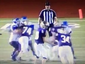 A pair of high school football players in Texas appeared to target this referee shortly after this still frame showing the play.