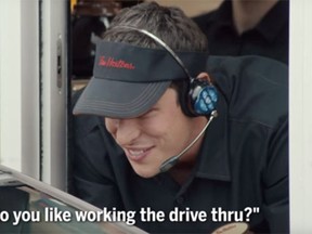 Sidney Crosby serves coffee at a Dartmouth, N.S., Tim Hortons as part of a commercial shoot for the coffee chain. (YouTube screen grab)
