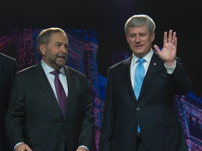 NDP leader Tom Mulcair and Conservative leader Steven Harper pose for a photo prior to the Globe and Mail hosted leaders' debate in Calgary on Sept. 17, 2015. (THE CANADIAN PRESS/Jonathan Hayward)