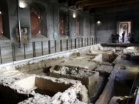 Cameramen film an excavation site inside the Sant'Orsola monastery in Florence, Italy, Thursday, Sept. 24, 2015, where archeologists found bones they hoped belonged to Lisa Gherardini, the woman some believe posed for the famous Leonardo da Vinci’s Mona Lisa painting.  Italian experts said during a press conference they can't say with certainty whether the bones dug up in the monastery are those of the Renaissance-era noblewoman. (AP Photo/Francesco Bellini)