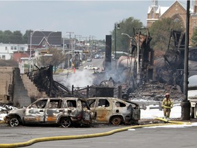 This July 8, 2013 file photo provided by Surete du Quebec, shows wrecked oil tankers and debris from a derailment in Lac-Megantic, Quebec, Canada. Part of the city was leveled and 47 people died. (AP Photo/Surete du Quebec, The Canadian Press, File)