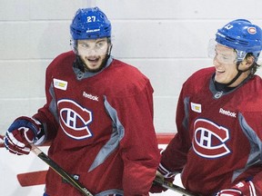 Canadiens forwards Alex Galchenyuk (left) and Alexander Semin (right) chat during training camp in Brossard, Que., on Friday, Sept. 18, 2015. (Graham Hughes/THE CANADIAN PRESS)