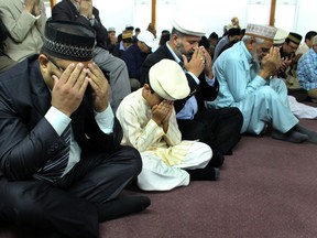 Muslims during prayer service. Edmonton Muslims are celebrating the happy occasion of Eid on Thursday, September 24th, at Hadi Mosque in Edmonton, Alta.  Perry Mah/Edmonton Sun