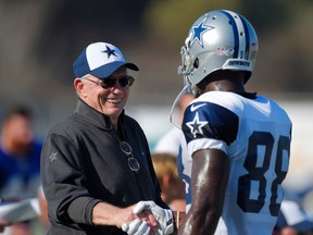Cowboys owner Jerry Jones (left) talks with receiver Dez Bryant training camp in Oxnard, Calif., on Aug. 18, 2015. With the loss of quarterback Tony Romo for the next two months and Bryant still out, Jones believes the Cowboys will get better as the season progresses. (Mark J. Terrill/AP Photo)
