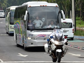 Fathers and relatives of the 43 missing students from Ayotzinapa arrive in a bus to a private meeting with the Mexican President Enrique Pena Nieto, in Mexico city, on September 24, 2015. Parents of 43 Mexican students who disappeared last year began yesterday a 43-hour hunger strike, a day before meeting with President Enrique Pena Nieto ahead of the case's anniversary.  AFP PHOTO/RONALDO SCHEMIDT