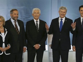 (L-R) Green Party leader Elizabeth May, New Democratic Party leader Thomas Mulcair, Bloc Quebecois leader Gilles Duceppe, Conservative leader and Prime Minister Stephen Harper and Liberal leader Justin Trudeau pose before the start of the French language leaders' debate in Montreal, Quebec September 24, 2015. REUTERS/Christinne Muschi