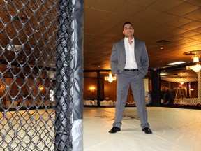 Sunny Sareen poses in the cage where Unified MMA 24 will be fought on Friday, at the Mirage Banquet Hall, which his family owns. (Perry Mah, Edmonton Sun)