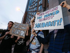 University of Toronto protesters were escorted outside the Intercontinental Hotel where Columnist Cathy Young was speaking on 'The Politics of Gender and Victimhood' on Thursday September 24, 2015. Stan Behal/Toronto Sun/Postmedia Network