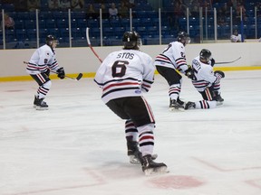 Forward Jordan Fogarty, far right, goes to his knees to celebrate a goal Thursday at Sarnia Arena. Fogarty's marker, which came in the second period, sent the game with the St. Thomas into overtime. Anne Tigwell / SPECIAL TO THE OBSERVER