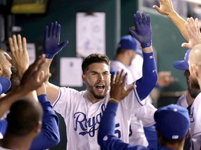 Kansas City Royals’ Eric Hosmer celebrates in the dugout after hitting a home run during the fifth inning against the Seattle Mariners Thursday, Sept. 24, 2015, in Kansas City, Mo. (AP Photo/Charlie Riedel)