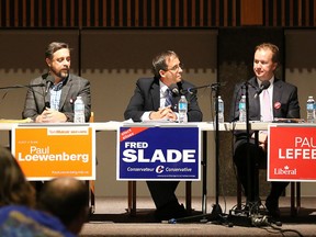 NDP candidate Paul Loewenberg, Conservative Fred Slade and Liberal Paul Lefebvre listen as Green candidate David Robinson makes a point at the CBC Sudbury debate for the Sudbury riding candidates at St. Andrew's Place in Sudbury, Ont. on Thursday September 24, 2015. Gino Donato/Sudbury Star/Postmedia Network