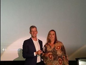 Parkside Collegiate Institute coach Darlene Denniss, right, accepts the Coaches Association of Ontario's 2015 Excellence Award in Toronto on Sept. 19. Denniss, who has nearly 30 years of experience coaching, is this year's female award recipient in the school sports category.