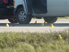 Manitoba's independent investigation unit investigate a scene just north of Winnipeg on Highway 59 near Highway 44 earlier this week. Winnipeg police officers shot and killed a 44-year-old man at the scene. (JIM BENDER/WINNIPEG SUN FILE PHOTO)