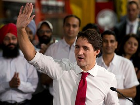 Liberal leader Justin Trudeau waves to supporters as he finishes his speech during a campaign stop in Brampton, Friday September 25, 2015. THE CANADIAN PRESS/Adrian Wyld