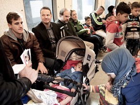 Migrants sit in a train headed to Sweden as it leaves Copenhagen Central Station Sept. 10, 2015.   REUTERS/Linda Kastrup/Scanpix