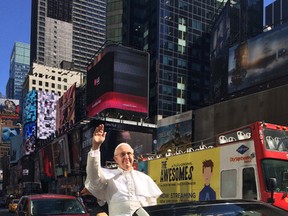 In this photo provided by Hillary Karsten, a wax likeness of Pope Francis is driven through the streets of New York City, Thursday, Sept. 24, 2015 as Pope Francis himself was heading toward St. Patrick’s Cathedral to give an evening prayer service. The likeness itself can be seen at Madame Tassaud’s in New York City. (Courtesy of Hillary Karsten via AP)