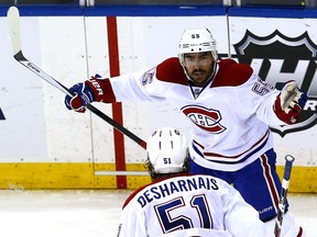 Francis Bouillon of the Montreal Canadiens celebrates with David Desharnais after scoring a goal during Game Four of the Eastern Conference Final in the 2014 NHL Stanley Cup Playoffs at Madison Square Garden. (Al Bello/AFP)