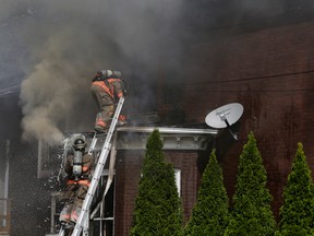 INTELLIGENCER FILE PHOTO BY EMILY MOUNTNEY-LESSARD
Members of the Belleville Fire Department battle a structure fire on Queen Street, on Friday September 25, 2015 in Belleville.