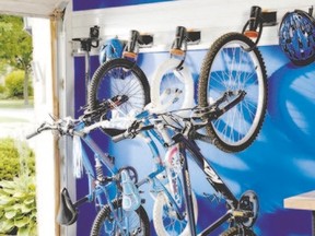 First rule of good garage organization? Get everything off the ground. Use racks to store awkward items like bicycles.