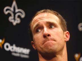 New Orleans Saints quarterback Drew Brees talks to the media regarding his shoulder injury from last Sunday's game against the Tampa Bay Buccaneers, during a news conference at their NFL football training facility in Metairie, La., Wednesday, Sept. 23, 2015. (AP Photo/Gerald Herbert)