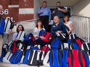 Wayne Wakeling, manager of Giant Tiger on Millennium Parkway and Frank Carney, owner of Giant Tiger on Sidney Street, dropped off 72 backpacks filled with school supplies at the Education Centre on Friday. Pictured left to right are: (back row) Wayne Wakeling and Frank Carney; (front row) Geoffrey Cudmore, chairman of the Learning Foundation board; Cherie Hardie, food and logistics co-ordinator; Maribeth deSnoo executive director of The Hastings and Prince Edward Learning Foundation; Vicky Van Roie, community development co-ordinator for Food For Learning; Wendy Fleet, fundraising assistant.