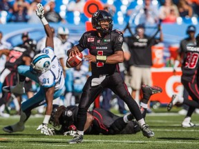 Ottawa RedBlacks' quarterback Henry Burris throws the ball against the Toronto Argonauts during the first half of CFL football action in Toronto, Sunday, August 23, 2015. THE CANADIAN PRESS/Mark Blinch