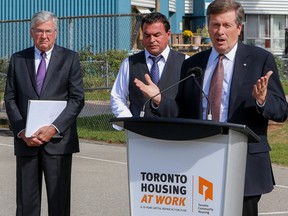 Toronto Mayor John Tory, along with City Councillor Georgio Mammoliti and Toronto Community Housing president and CEO Greg Spearn announce the launch of ReSet program to take care of repairs at the GrassWays complex near Jane St. and Finch Ave. W. on Sept. 25, 2015. (Dave Thomas/Toronto Sun)