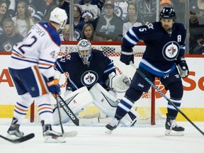 Oilers forward Anton Slepyshev watches Jets goaltender Ondrej Pavelec stop a shot during the second period of Friday's game in Winnipeg. (The Canadian Press)