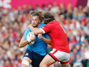 Italy's Joshua Furno (left) runs into Canada's Hubert Buydens during Rugby World Cup action at Elland Road in Leeds, England on Saturday, Sept. 26, 2015. (Action Images via Reuters/Ed Sykes)