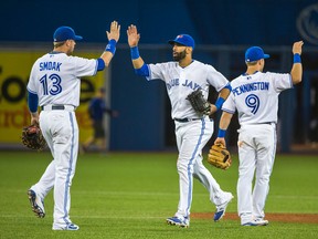 Blue Jays celebrate their win against the Rays in Toronto on Friday, Sept. 25, 2015. The Blue Jays then clinched a playoff berth overnight. (Ernest Doroszuk/Toronto Sun)
