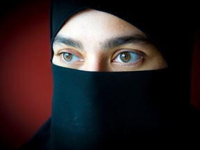 Mahwash Fatima, a mom and a businesswoman, has written a first person piece on why she wears the Niqab. Fatima is shown here at her home on Friday Sept. 25, 2015.
Ashley Fraser/Ottawa Sun
