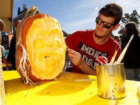 Adam Haley carves a pumpkin during Flavours of Fall Saturday. 
Emily Mountney-Lessard/The Intelligencer/Postmedia Network