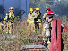 Kingston Fire and Rescue responds to 810 Montreal St., the old train station, for a structure fire  in Kingston, Ont. on Saturday September 26, 2015. Fire crews were just at the train station on Sept.24 when a piece of plywood had been set on fire inside.  Steph Crosier/Kingston Whig-Standard/Postmedia Network