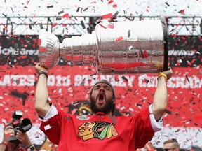 Brent Seabrook of the Chicago Blackhawks holds the Stanlet Cup trophy during the Chicago Blackhawks Stanley Cup Championship Rally at Soldier Field on June 18, 2015 in Chicago, Illinois. (Jonathan Daniel/Getty Images)