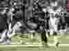 Ottawa Redblacks quarterback Henry Burris (1) fends off Toronto Argonauts' Martin Wright (79) and Euclid Cummings (94) as he runs the ball during first half CFL action in Ottawa on Saturday, Sept. 26, 2015. THE CANADIAN PRESS/Justin Tang