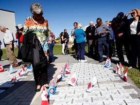 Attendees view stones dedicated to those who served with the 400 Squadron, which was honoured during the Ad Astra stone dedication at the National Air Force Museum of Canada, Saturday September 26, 2015 in Trenton Ont. Emily Mountney-Lessard/Belleville Intelligencer/Postmedia Network