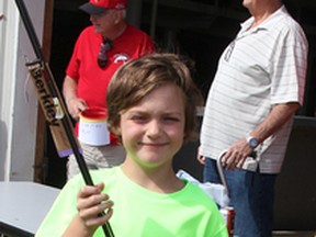 Sam Dezort, 7, won a new fishing rod but caught no fish during the annual Bluewater Anglers' fall derby on Saturday. Sam wasn't alone; 54 anglers were registered but none caught the derby's required trout or salmon. Organizers thought the reason might be the relatively warm temperatures of the fishing waters -- 66 degrees Fahrenheit.
Photo taken at Sarnia, Ontario on Saturday, Sept. 26, 2015
Neil Bowen/Sarnia Observer/Postmedia Network