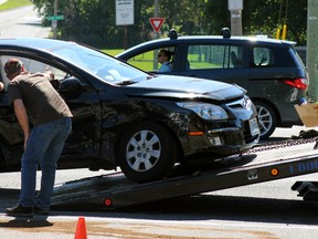 A Hyundai Touring and Honda Civic collided in the intersection of Bath Road and Portsmouth Avenue in Kingston, Ont. on Sunday September 27, 2015. The passenger of the Hyundai was taken to hospital as a precaution. Steph Crosier/Kingston Whig-Standard/Postmedia Network