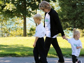 Miksa Kesco, 6, leads his grandmother Candace Thornton and baby sister Laila Kesco  at the Kidney Walk in Kingston, Ont. on Sunday September 27, 2015. Over $20,000 was raised for kidney-disease research. Steph Crosier/Kingston Whig-Standard/Postmedia Network